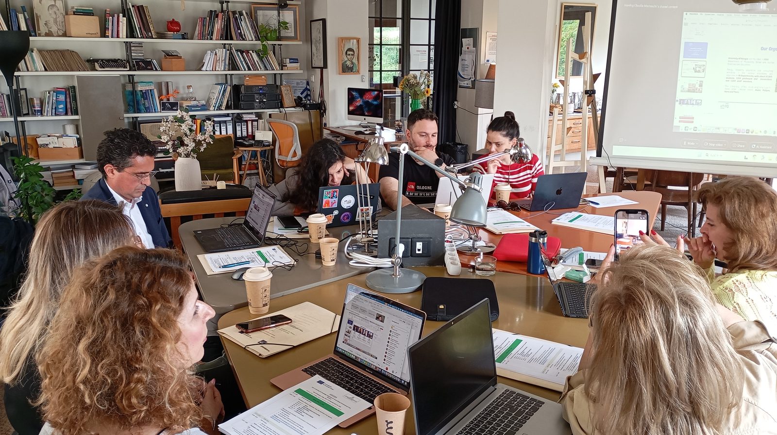 Partners gathered around a working table during the ALKI Kick-Off Meeting in Larissa
