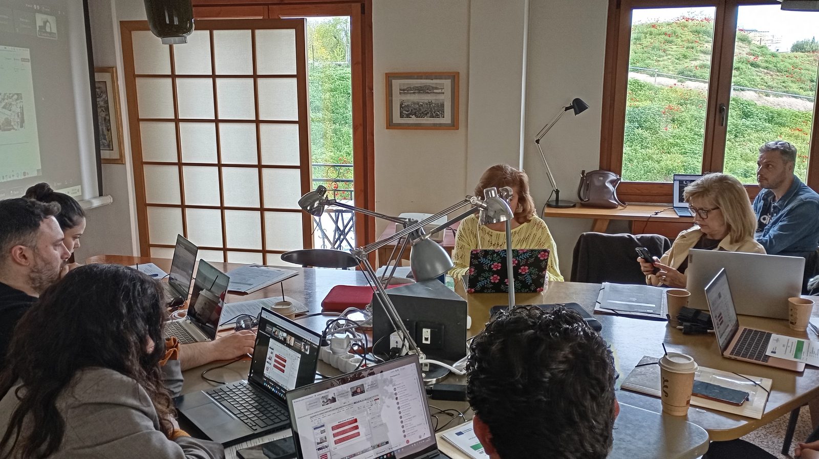 Wide view of the consortium working together on Day 1