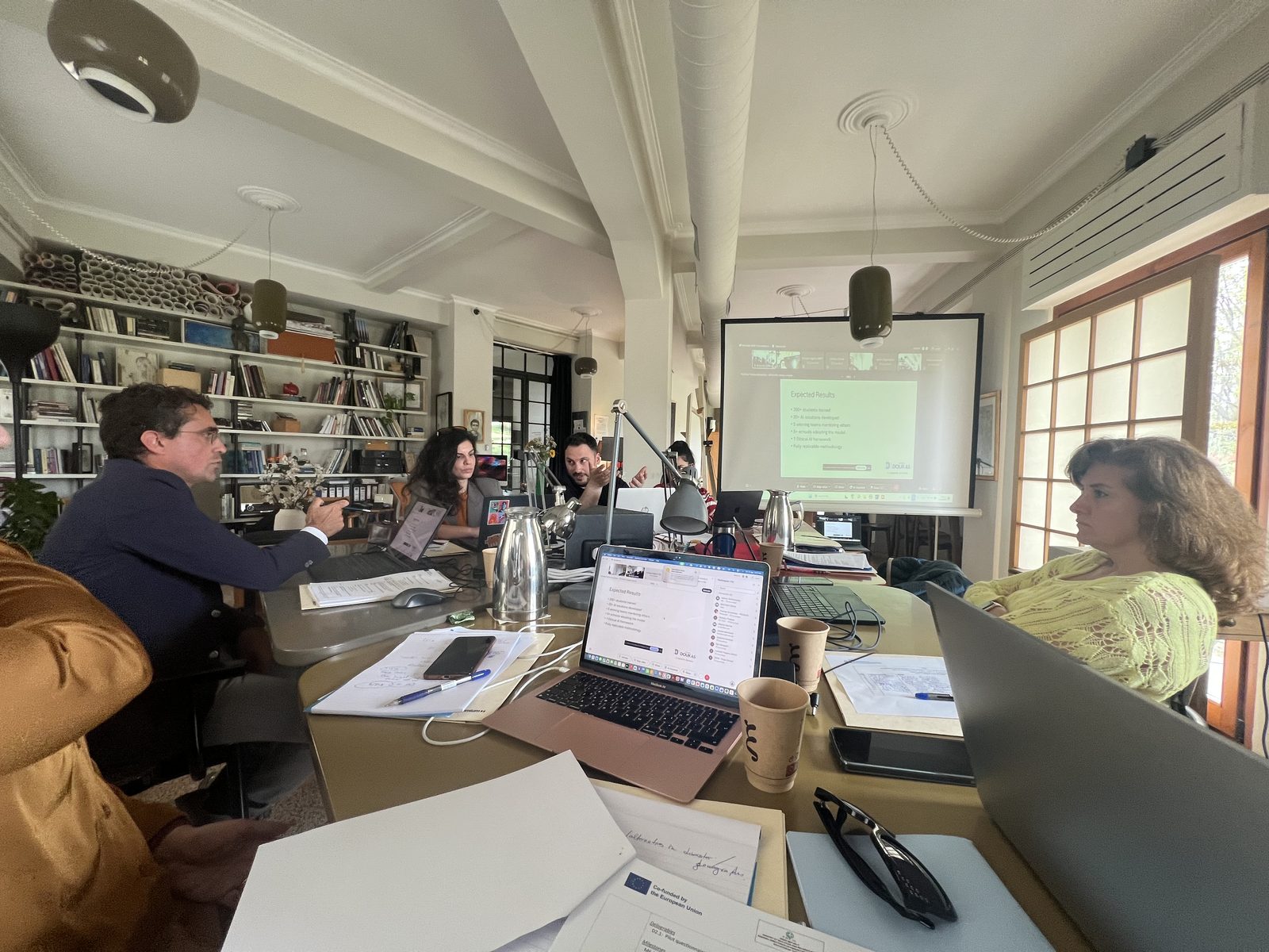 Partners reviewing the WP2 pilot survey presentation